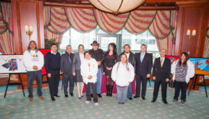 Group photo of the Friends United team at the Halifax Exhibition 2013 at Casino Nova Scotia in Halifax, Nova Scotia. Back row (left to right): Jay Bell Redbird, Morley Googoo, Lorne E. Julien, Raven Davis, David J. Brooks, Chelsea Brooks, Darren Julian, Rodney MacDonald, Rolf Bouman and Fancy PeterPaul. Front row: Sandra Simon and Amanda Julian.