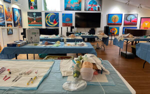 Emergency Health Services training setup inside the Friends United International Convention Centre surrounded by Indigenous art