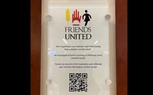 Friends United plaque crediting Mi’kmaq artist Loretta Gould at Halifax Stanfield International Airport