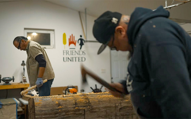 Gerry Sheena and Eric Schweig carving together at Friends United