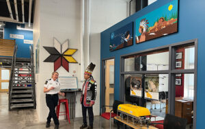 Hereditary Chief Stephen Augustine at the Indigenous art installation at the Canada Border Services Agency in Halifax