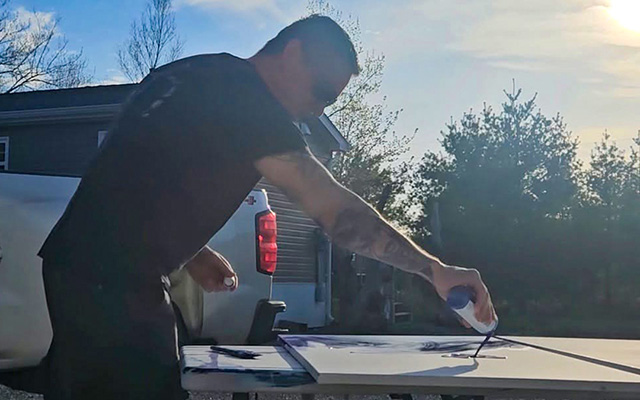 Jasyn Lucas painting outdoors at Friends United