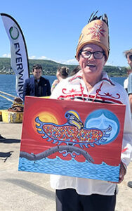 Membertou Chief Terry Paul with Indigenous artwork at an EverWind tugboat christening