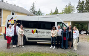 Friends United and Mi’kmaw Native Friendship Centre representatives beside a Friendship Centre vehicle